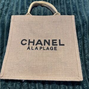 Brand new GWP CHANEL À La Plage woven straw Tan Tote with bold black lettering.